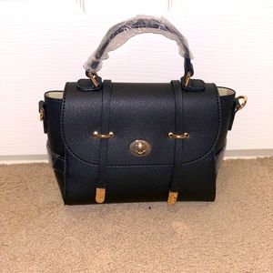 Small black crossbody and/or shoulder bag with detachable shoulder strap.
